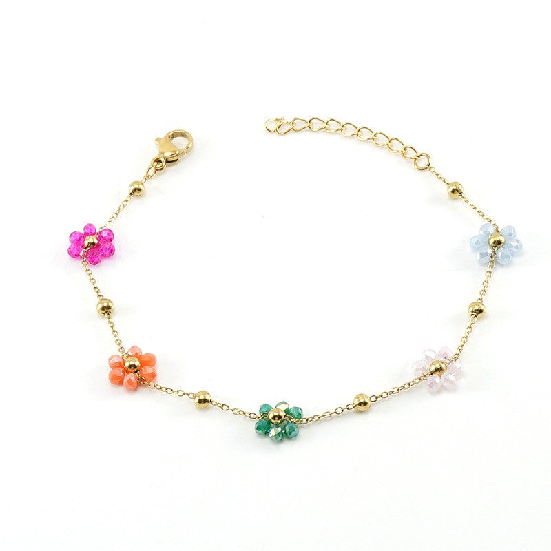 pulsera con abalorios de cristal miyuki y flores de colores para verano. el material es acero hipoalergénico bañado en oro 18 k y resistente al agua. Gold plated stainless steel waterproof flower bracelet