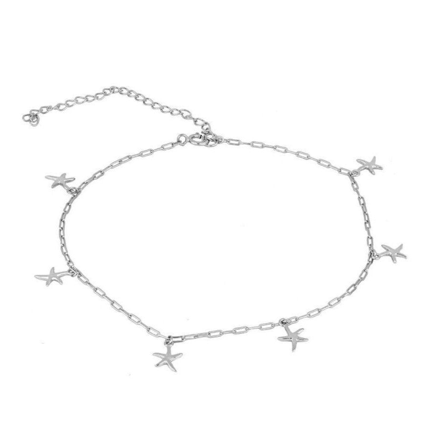 tobillera de plata de ley con baño de oro y 6 estrellas de mar. Gold plated silver anklet with starfish charms.