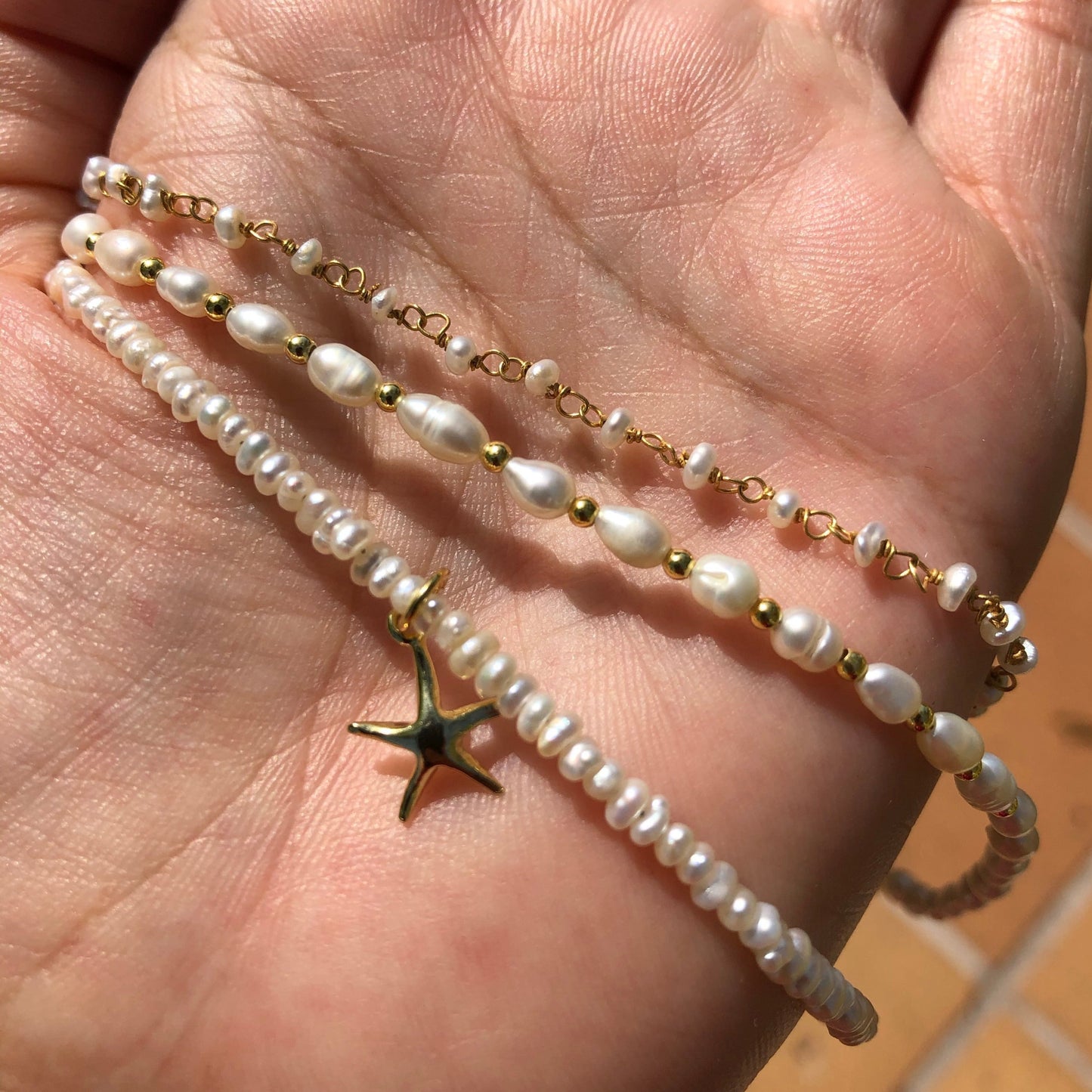 Colgante o charm de estrella de mar para personalizar una gargantilla o pulsera en plata de ley con baño de oro 18 kilates