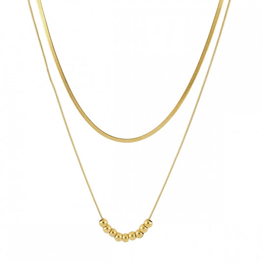 Collar boho de dos cadenas juntas, una de bolitas y otra de escama herringbone. Es de acero hipoalergénicos resistente al agua. Son 2 collares en 1.