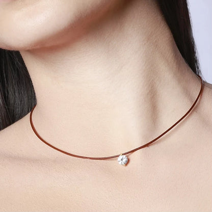 collar de hilo o cordón en color marron con brillante punto de luz. Gold plated sterling silver bead brown thread zircon necklace.