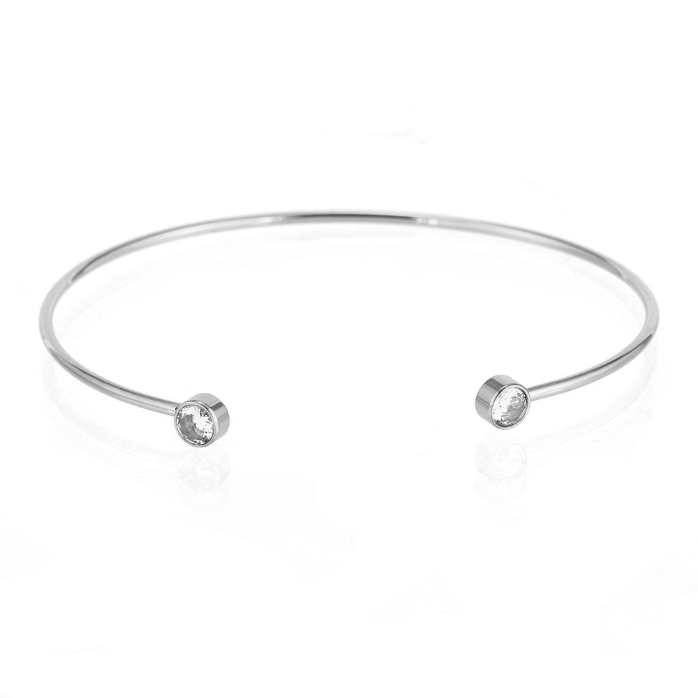 pulsera esclava plateada ajustable y fina con dos circonitas. Es el regalo perfecto para adolescentes, madres y amigo invisible. Es de acero hipoalergénico y resistente al agua 