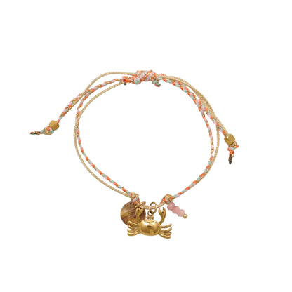 pulsera waterproof o resistente al agua confeccionada con cordón dorado y rosa con abalorios de piedra natural y acero dorado.  Cierre ajustable, colgante de concha, pez, cangrejo y abalorios de colores (CORAL, azul TURQUESA, naranja)